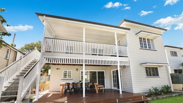 two storey home with a deck