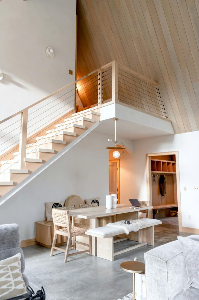Interior design reno dining room featuring a cohesive color palette, coordinated wall paint, trim finishes, and balanced lighting for a unified space.